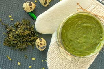 Flat lay body cosmetics concept. Body peeling. Natural facial and body mask or scrub with coffee, sea salt, seaweeds, quail egg and natural oil. © Iryna Bidovska