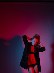 Fototapeta premium woman afro pigtails raincoat dance floor lights