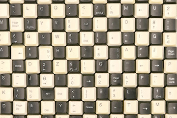 set of keys from old computer keyboards laid out on the table