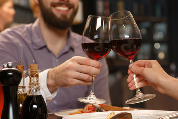 Delightful evening. Cropped shot of a happy loving couple having wine together at the local restaurant