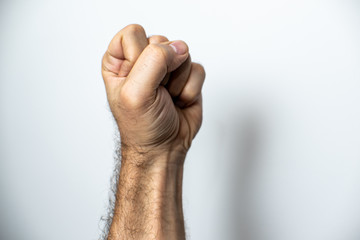 Clenched fist over white background