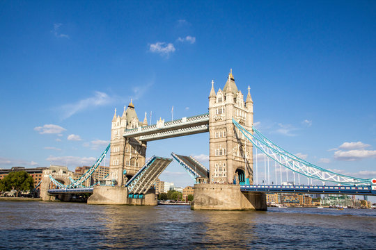 View of Tower Bridge on the River Thames opening for passing boats