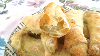 A close-up photo of a puff pastry products showing all the layers of dough. Macro photography. Top view