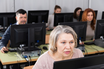 Mature woman learning to use computer