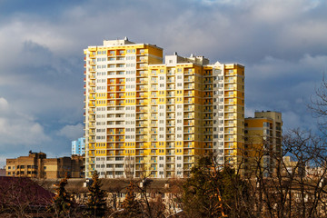 new high-rise building on a sunny spring day