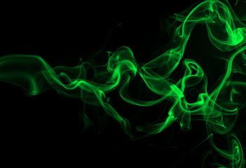 Green smoke on black background and darkness concept