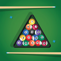 Billiard stick and pool balls in triangle on green table for game. Biliard balls, triangle and cue for game on green table top view.