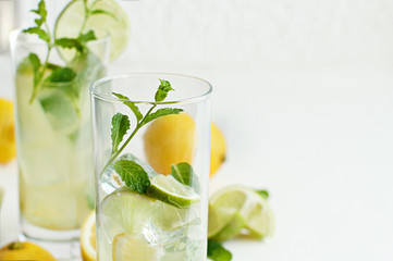 Homemade refreshing drink with lemon and lime juice and mint