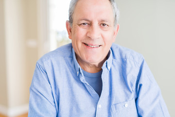 Handsome senior man smiling confident