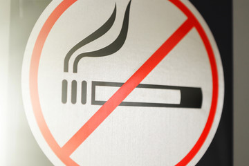 Sign smoking is prohibited close-up. Toned
