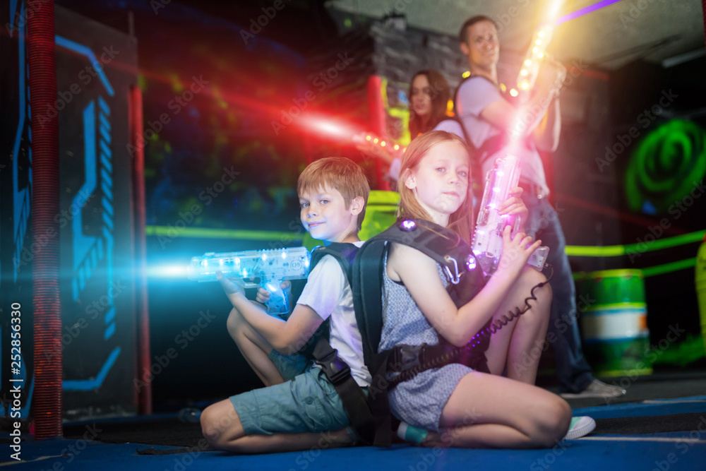 Canvas Prints Kids sitting back to back in laser beams