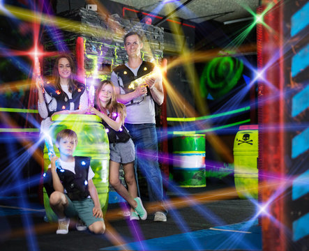 Kids and adults in beams on lasertag arena