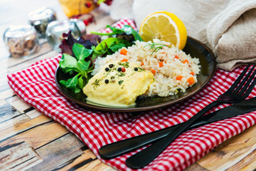 Andalusian fish, saffron rice with vegetables