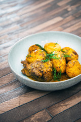Piece of roasted pork and potatoes