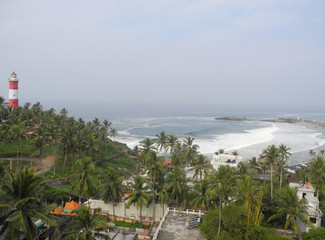 Obraz premium Sea, palm trees and lighthouse, Kerala, Trivandrum, Kovalam