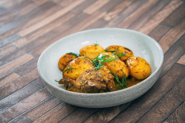 Piece of roasted pork and potatoes