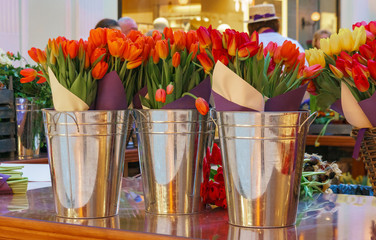 Flower shop concept. Close-up beautiful lovely bouquet of mixed flowers on wooden table. Flowers composition. Abstract background of flowers.