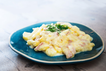 Gratin Of Potatoes, Ham, Eggs And Onions