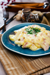 Gratin Of Potatoes, Ham, Eggs And Onions