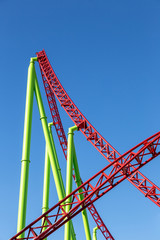 rollercoaster against blue sky