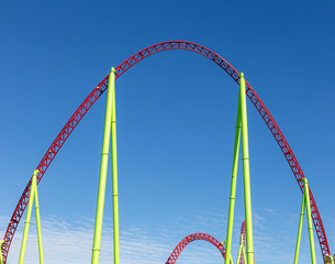 rollercoaster against blue sky