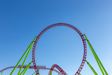 rollercoaster against blue sky