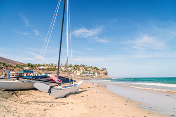 Fototapeta na wymiar Catamaran on Fuerteventura's beach, Morro Jable, Jandia Peninsula, Spain