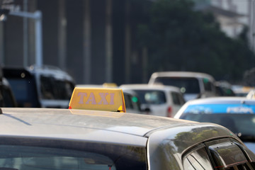 Taxi light sign or cab sign in yellow color on the car roof.