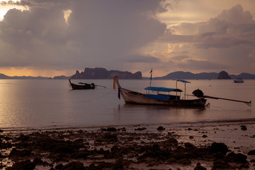 Tropical beach, long tail boats,golden sunset, gulf of Thailand,Krabi,