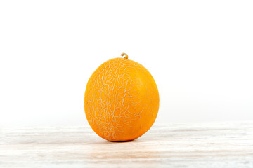 Whole melon against white background, isolated. View directly, Copy space