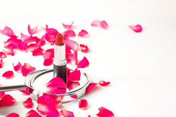 Obraz na płótnie Canvas rose petals of roses with red lipstick cosmetic product mockup