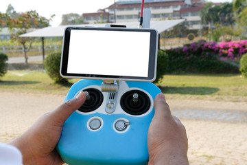 man controlling agriculture drone. remote controller