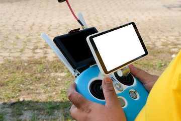 man controlling agriculture drone. remote controller