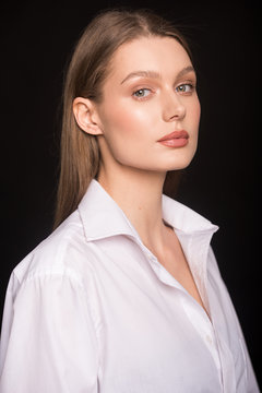young girl.  beautiful girl.  office worker.  shirt.  light makeup. business