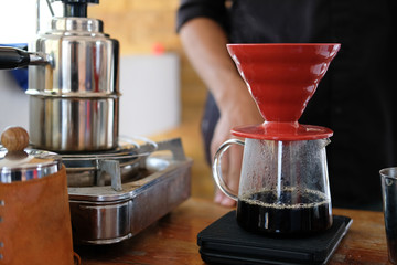 hot water pouring on coffee power in filter paper