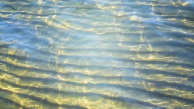 Sea waves rolling on clean sand beach of tropical ocean coast.