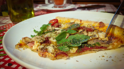  Close up of eating Slice of pizza in cafe 