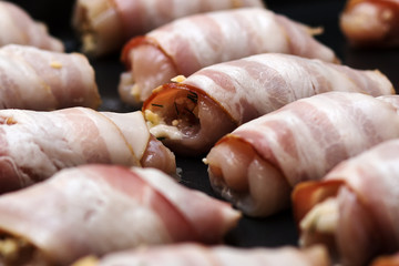 Chicken, cheese and bacon rolls. The process of cooking in the oven.