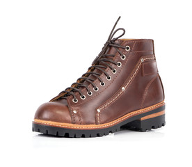 Men’s brown boot isolated on a white background.