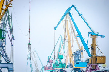 Fototapeta premium indastrial crane in cargo port at winter