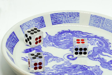 fifteen point dice in bowl on white background
