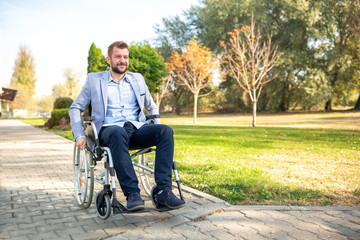 Young physically challenged man in his wheelchair