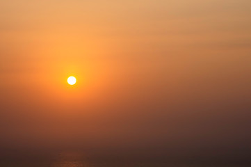 The morning sun light reflects the sea and fishing boats.