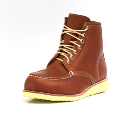 Men’s brown boot isolated on a white background.
