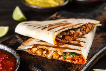 Chicken quesadillas with paprika, cheese and cilantro