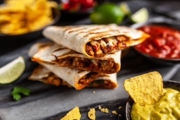 Chicken quesadillas with paprika, cheese and cilantro