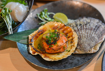 Grilled fresh scallop with soil sauce