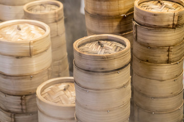 Steamed dim sum bamboo trays by Local street food vendors in Singapore