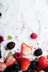 Fresh and Frozen Berries on Stylized Yogurt Surface