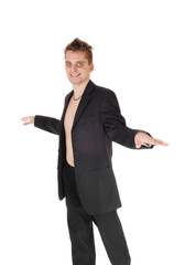 Man standing in suit shirtless pointing away